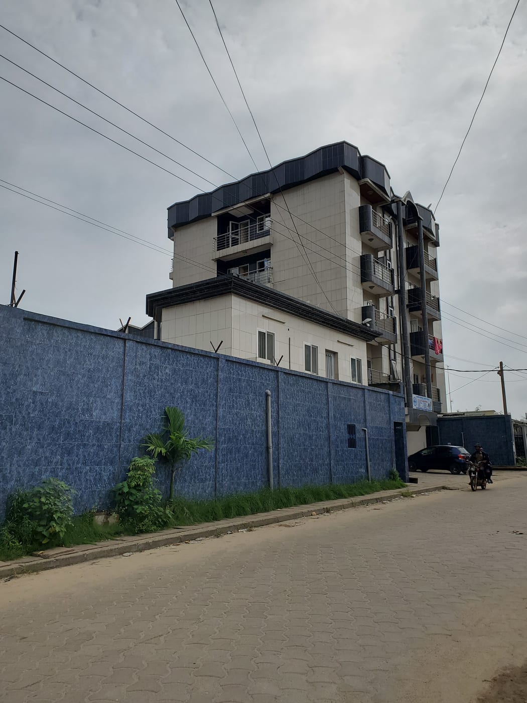 Street view of the MAVA Collections tailoring atelier exterior and courtyard in Douala